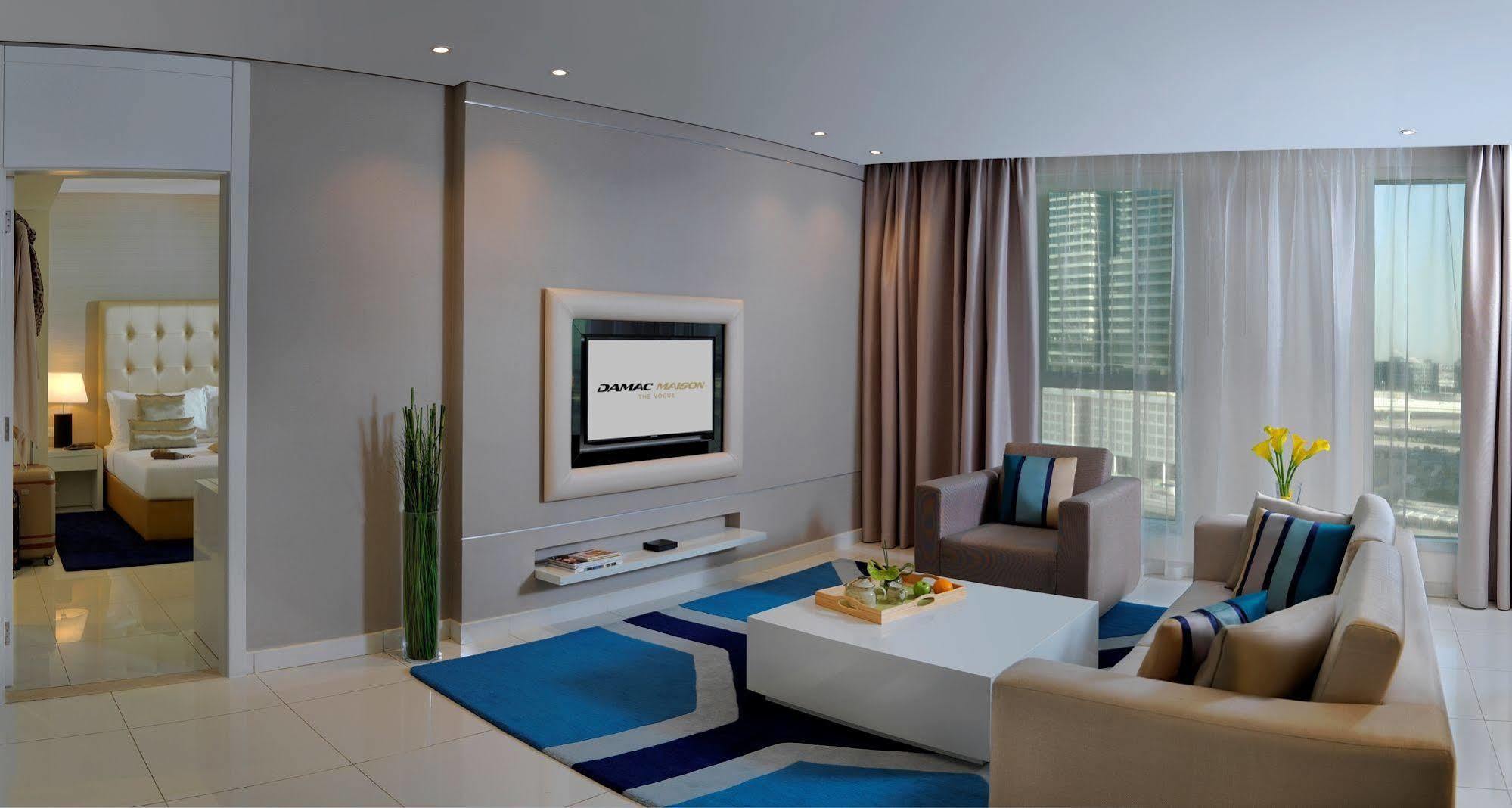 Damac Maison The Vogue Ντουμπάι Εξωτερικό φωτογραφία A living room with a television
